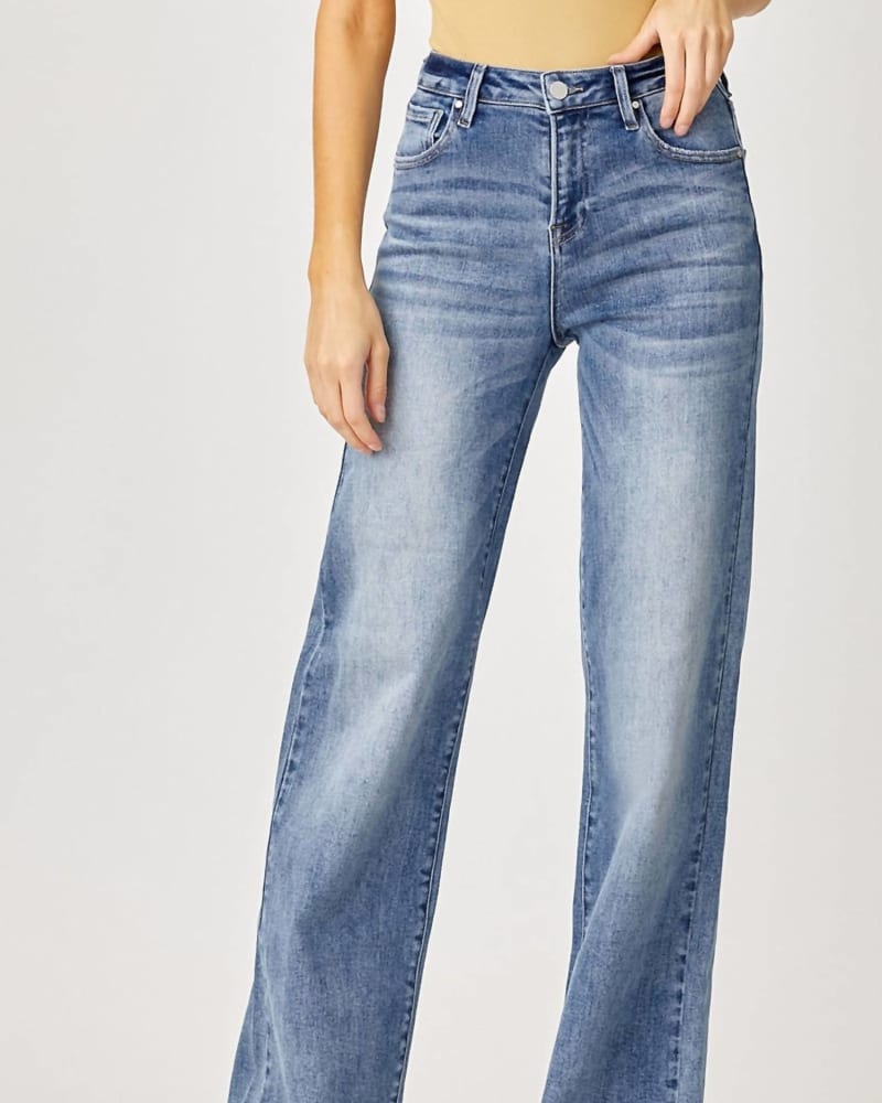 Front of a model wearing a size 18 Mid-Rise Wide Leg Jean in Blue in Blue by RISEN. | dia_product_style_image_id:326167